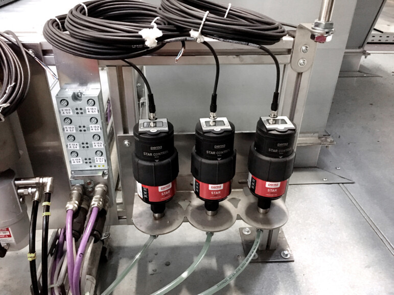 three perma STAR CONTROL automatic lubrication systems