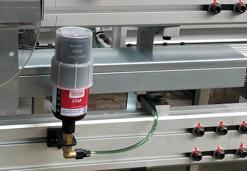 a perma STAR VARIO automatic lubrication system mounted remotely onto a lube point
