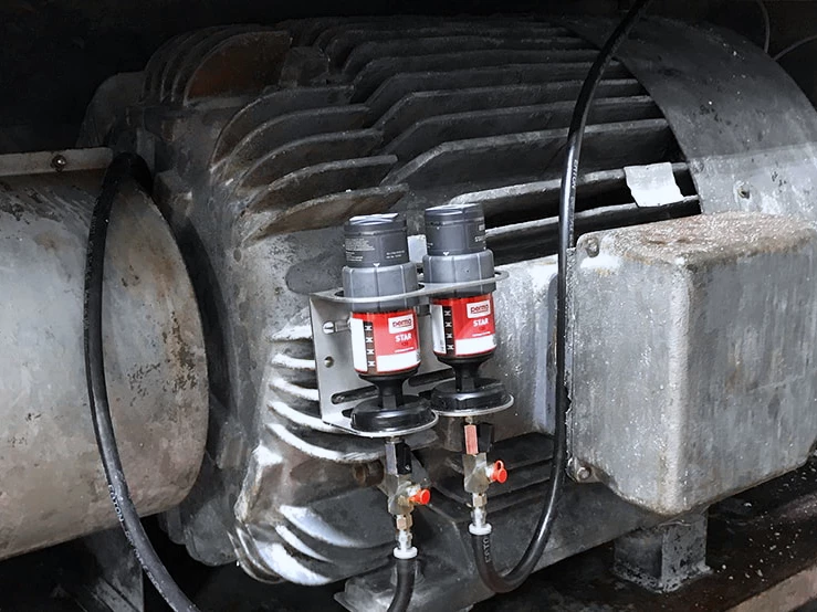 two perma STAR VARIO automatic lubrication systems on heavy machinery