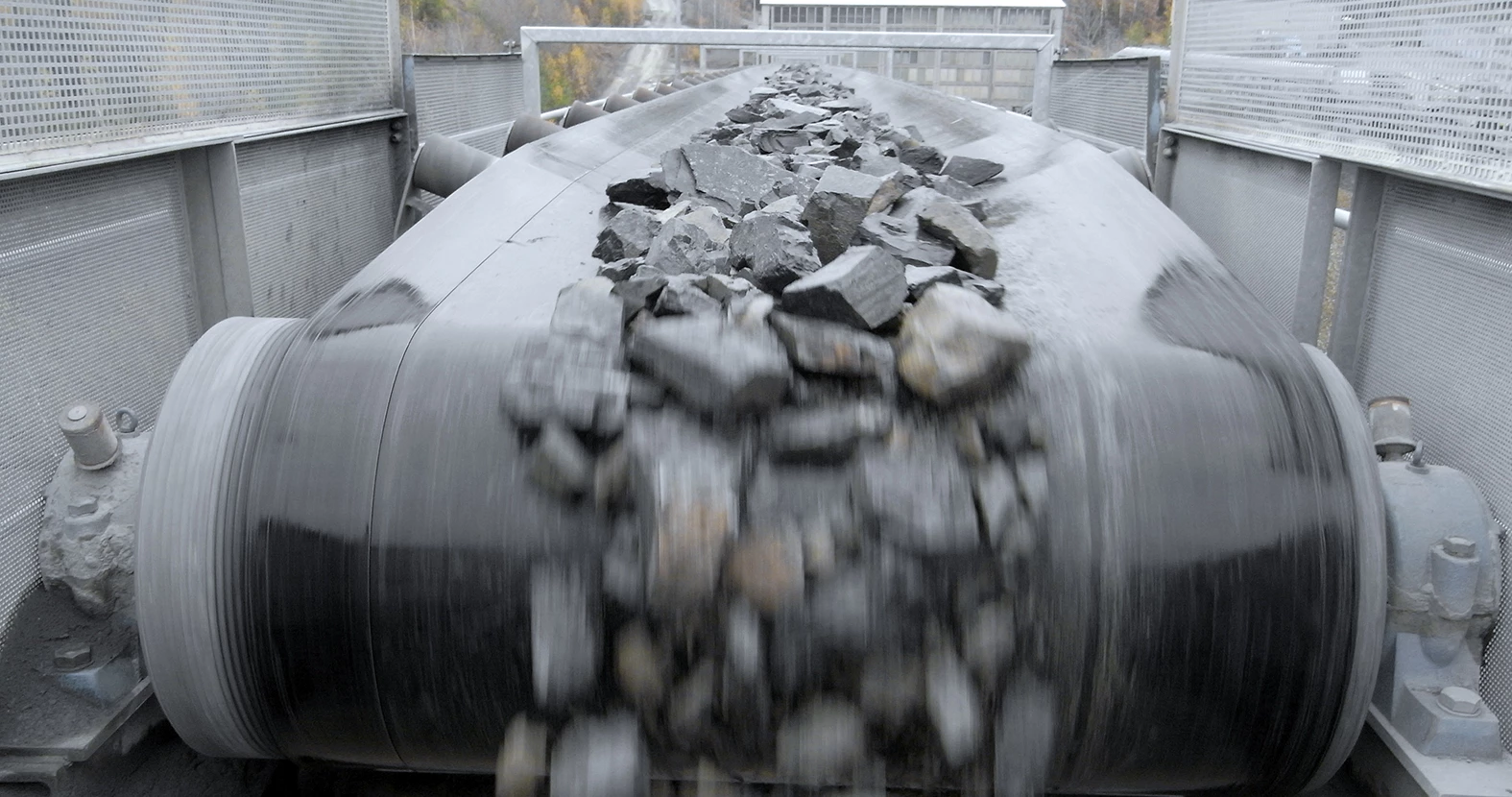 rocks falling from the end of a conveyor