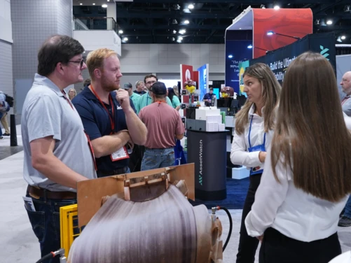 Visitors learn about automatic lubrication and reliability solutions at the perma USA booth during SMRP 2026.