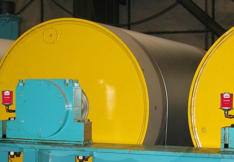perma CLASSIC automatic greasers mounted on steel industry equipment