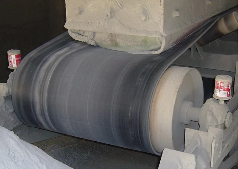 two perma CLASSIC auto greasers mounted on a conveyor