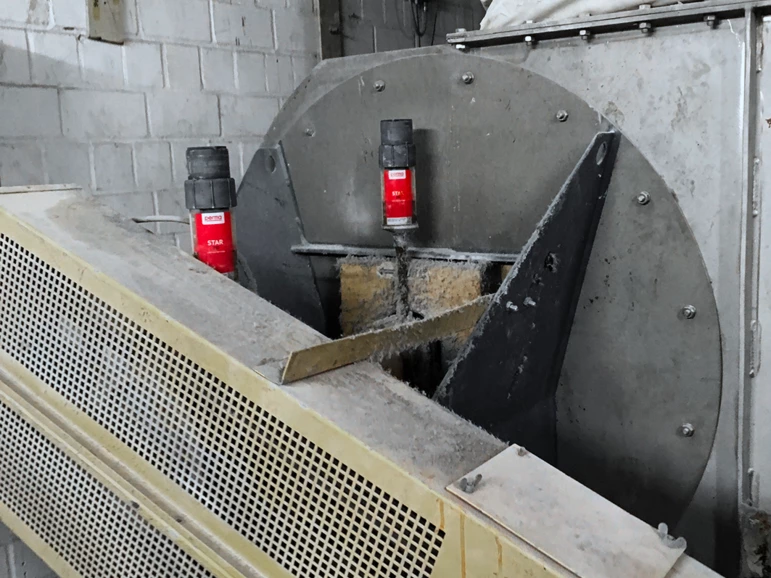 two perma STAR VARIO automatic greasers mounted on heavy machinery