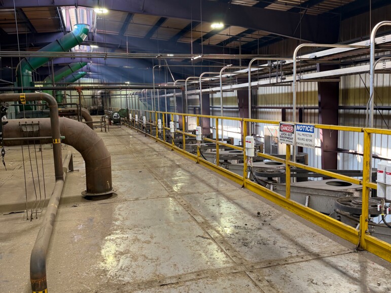 pulp & paper plant with yellow railing