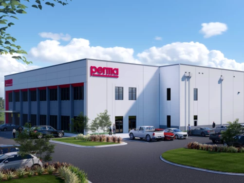 A picture of perma USA's Charlotte location. A large white building with a red perma sign.
