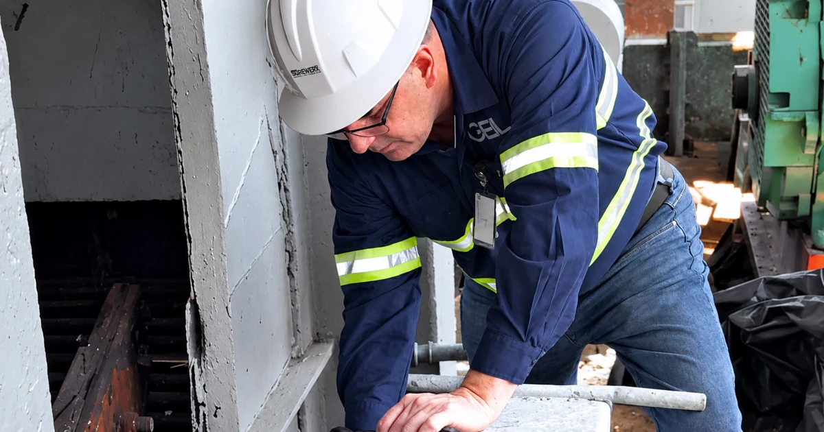Maintenance technician inspecting industrial equipment