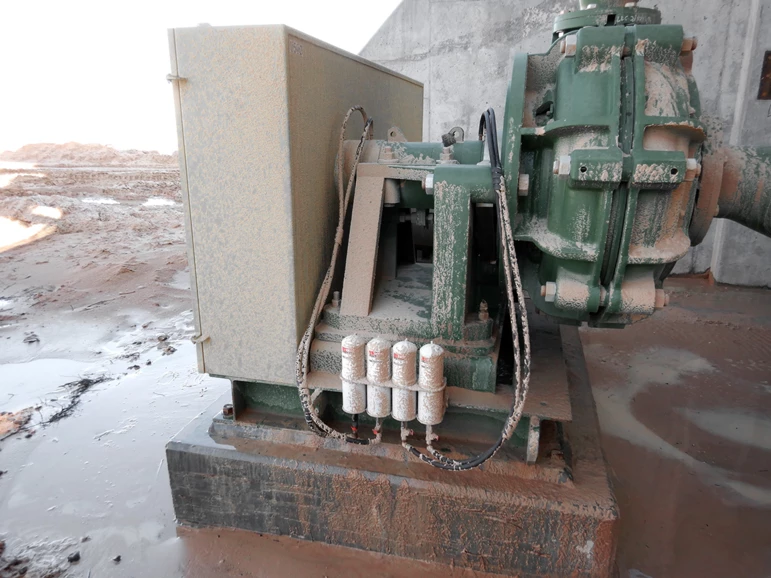 four perma STAR VARIO automatic lubricators mounted remotely to industrial machinery